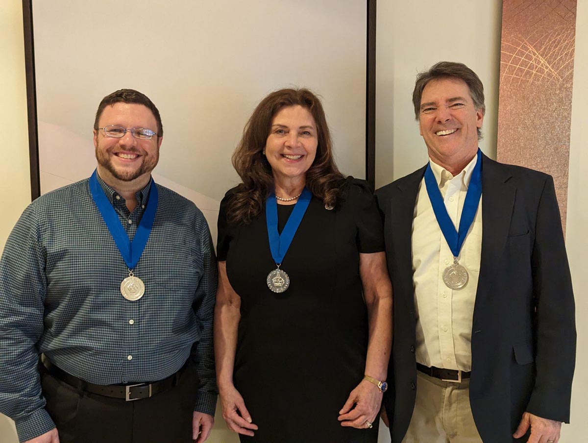 NVCC CEO Lisa Dresdner (center) and PTK co-advisors (l to r) Alan Teitleman and Greg Harding received PTK awards this spring for their leadership.